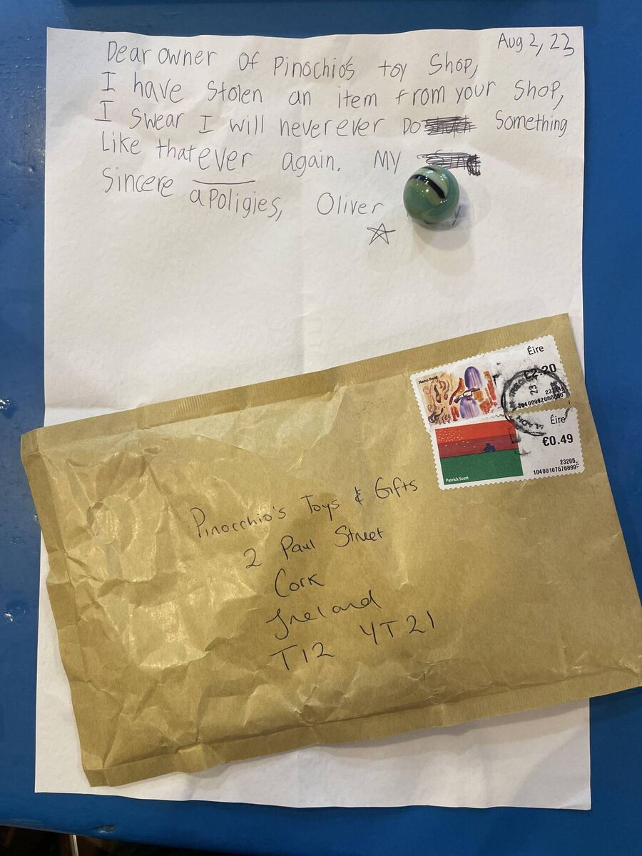 The apology letter and the stolen marble. Photo:@pinocchios_toys (Instagram). The apology letter and the stolen marble. Photo:@pinocchios_toys (Instagram).