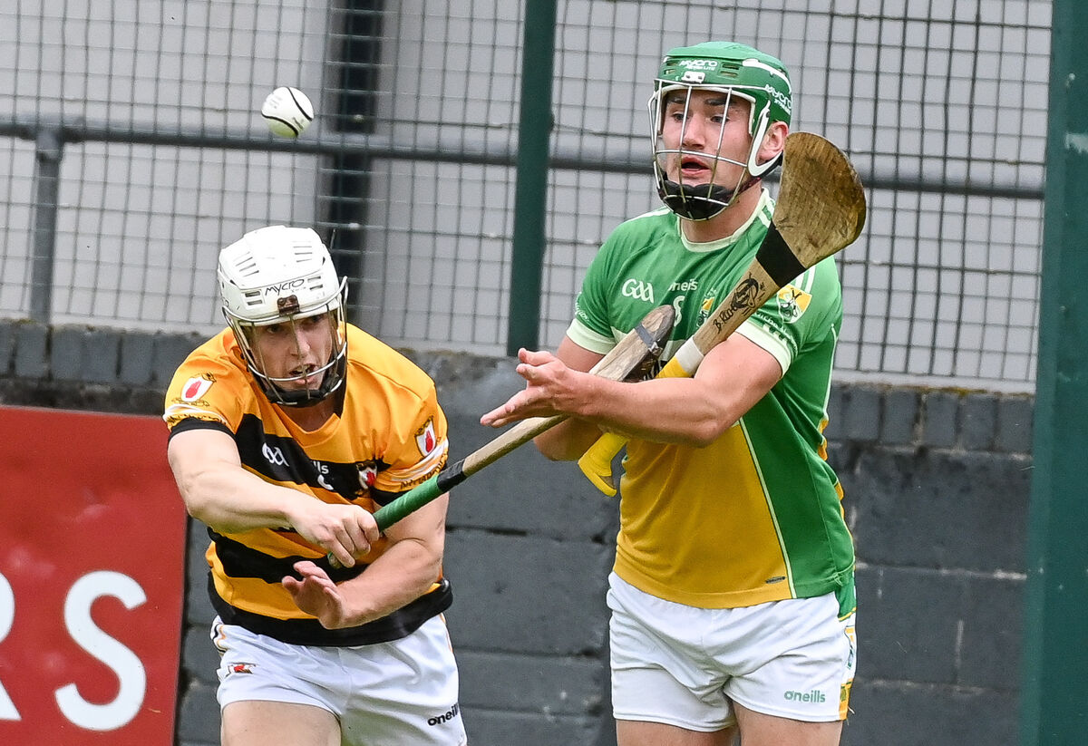  Bride Rovers' Brian Roche gets his pass away under pressure from Na Piarsaigh's Danny Gunning, during their SAHC clash at Riverstown.