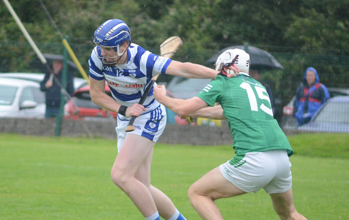 Andrew McCarthy of Inniscarra breaks away from Killeagh's Dylan McCarthy. Picture: Howard Crowdy