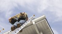 Home Repairs Handyman Up a Ladder outdoors