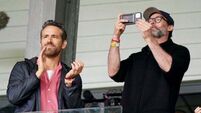 Hugh Jackman watches Wrexham game with Ryan Reynolds and Rob McElhenney