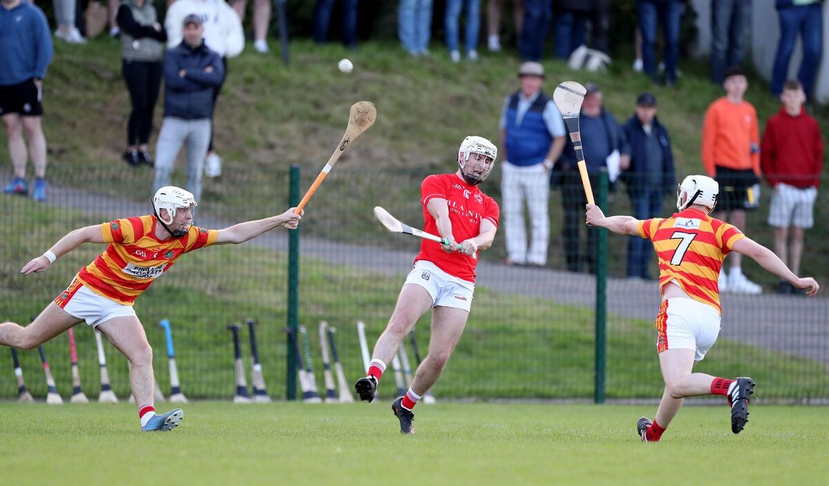  Luke Meade and Eoghan Collins, Newcestown, closed in on Denis McSweeney, Blarney. Picture: Jim Coughlan.