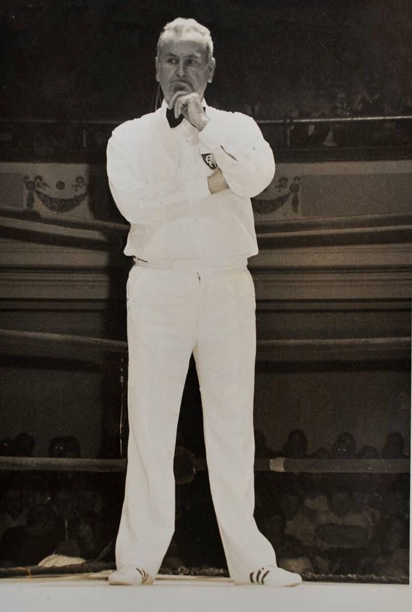 Victor J. Aston in familiar pose as he officiates at a tournament in 1977. Victor J. Aston in familiar pose as he officiates at a tournament in 1977.