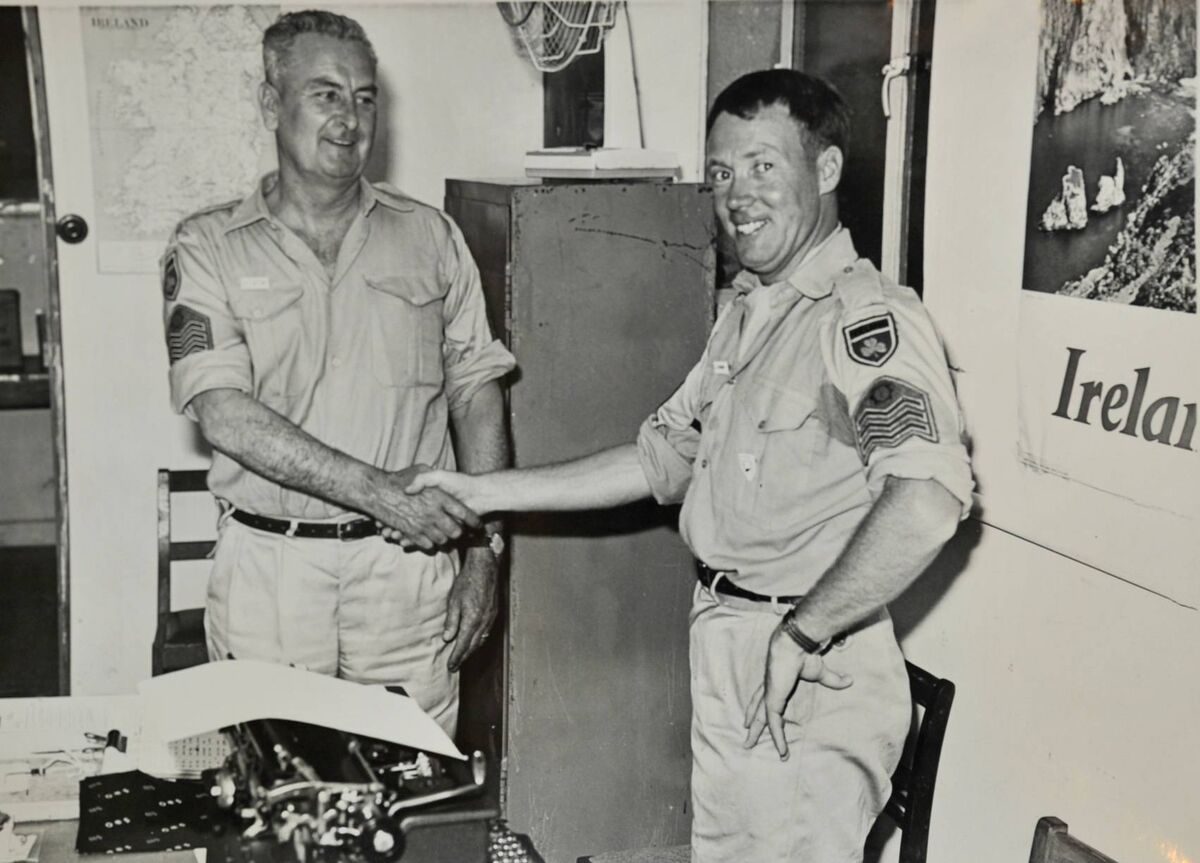 Company Sergeant Victor Aston congratulates his predecessor, Coy Sgt Gerry Benson of Limerick, as he takes over his post in Cyprus in June 1968. (Photo courtesy of Military Archives) Company Sergeant Victor Aston congratulates his predecessor, Coy Sgt Gerry Benson of Limerick, as he takes over his post in Cyprus in June 1968. (Photo courtesy of Military Archives)