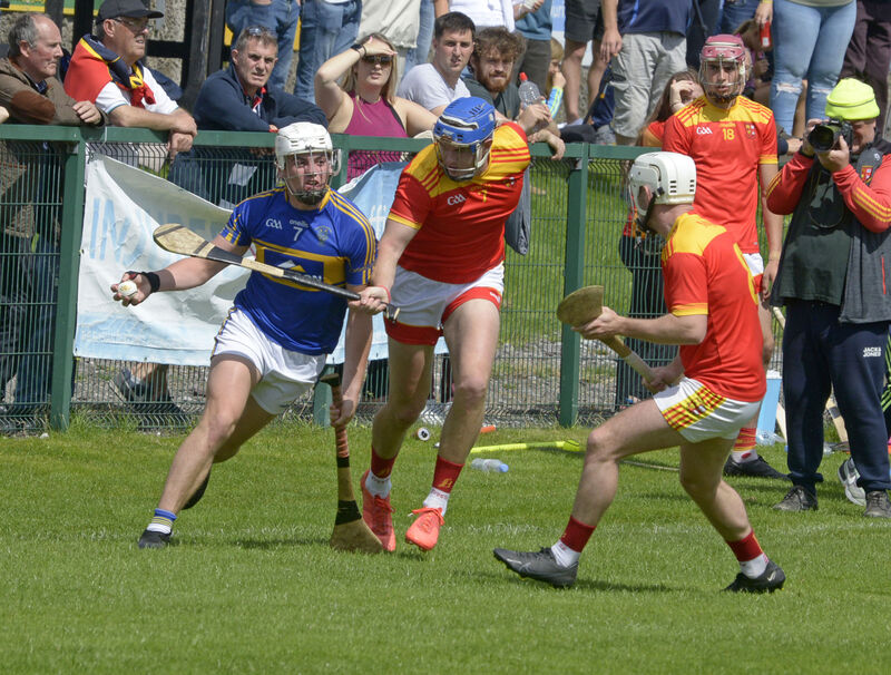  Daniel Murnane of Carrigtwohill tries to evade Mallow's Darragh Moynihan. Picture: Denis Boyle