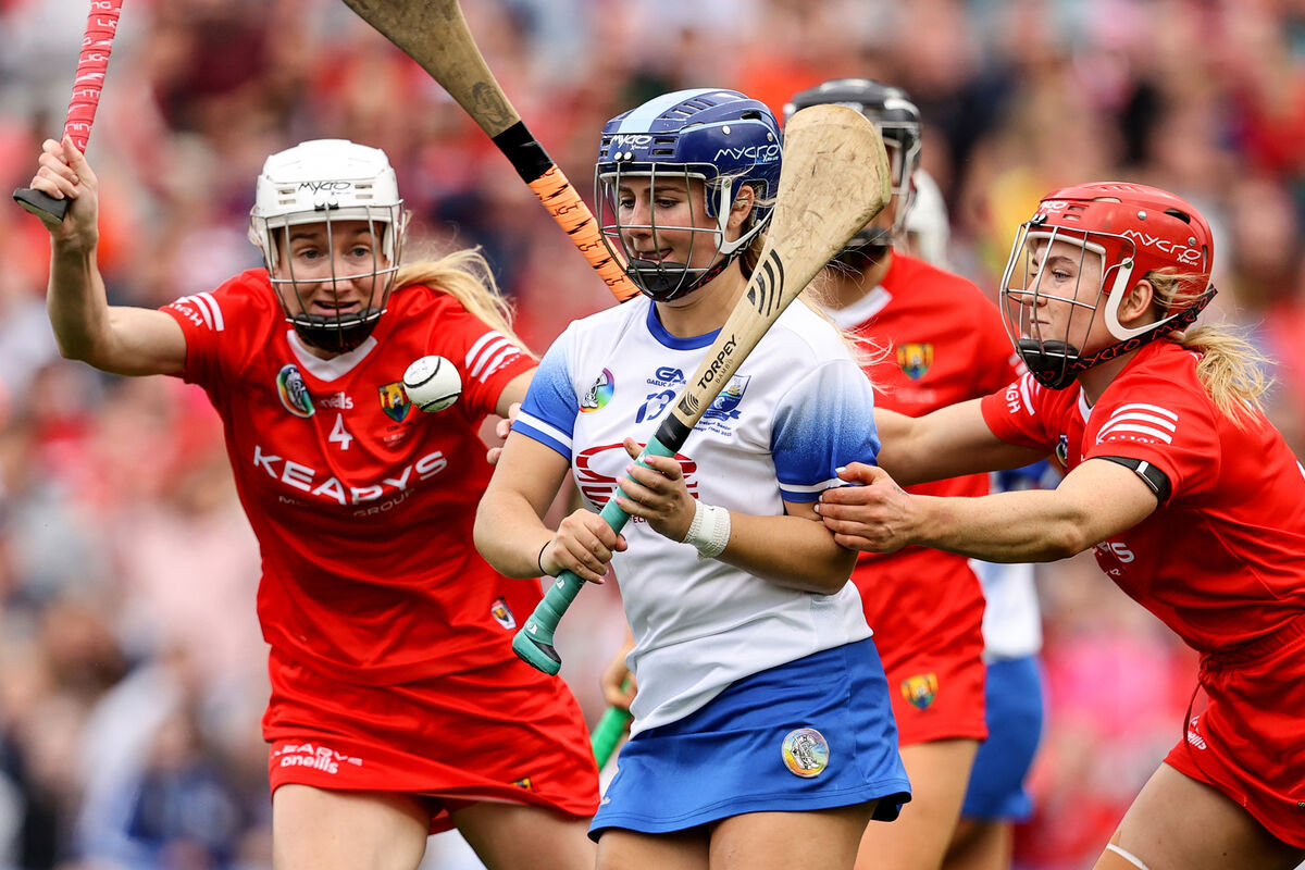 Waterford's Annie Fitzgerald is hounded by Pamela Mackey and Libby Coppinger. Picture: INPHO/Ben Brady