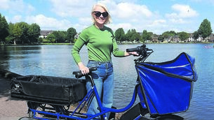 <p class="contextmenu internal_Caption">PEDAL POWER: Kathriona Devereux with her electric cargo bike, which has taken her 2,155 kilometres in the past year</p>