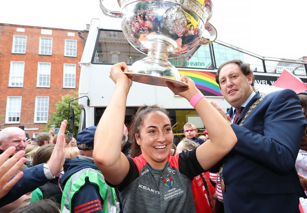 Cork Captain, Amy O'Connor, gets off the Bus with the O'Duffy Cup with Lord Mayor Cllr Kieran McCarthy, in the crowd. Cork Captain, Amy O'Connor, gets off the Bus with the O'Duffy Cup with Lord Mayor Cllr Kieran McCarthy, in the crowd.