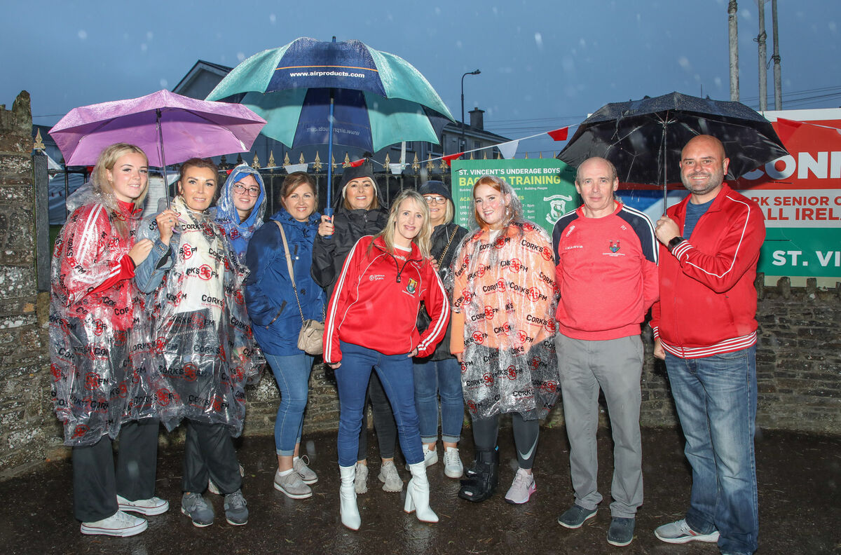 Supporters waiting in the rain for the arrival of the Cork team at the homecoming celebrations for the victorious All-Ireland Senior Camogie Final champions at St. Vincents Hurling, Football and Camogie Club, Knocknaheeny, Cork. Picture: David Creedon