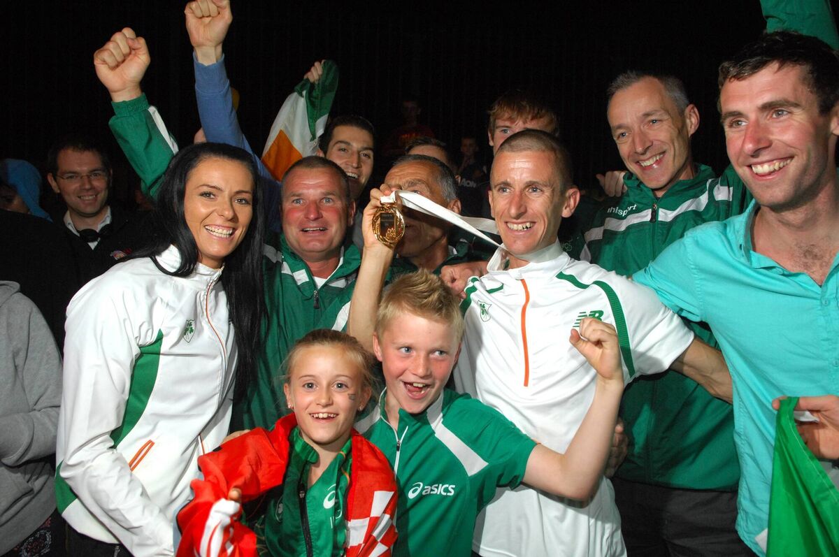 Part of the huge crowd who welcomed home Rob Heffernan , his wife Marian and children Adam and Megan to Cork last night , after winning gold in the 50k walk at the world championships in Moscow /Picture: Eddie O'Hare