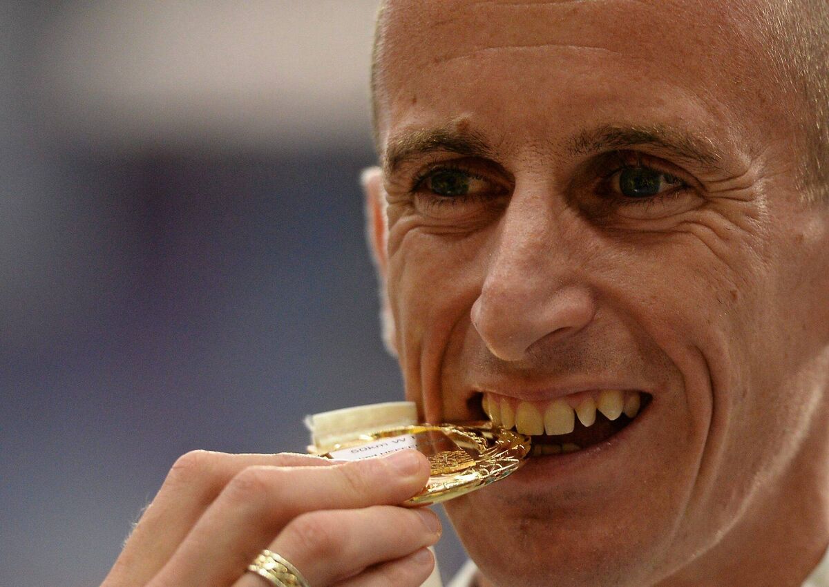 Ireland's Robert Heffernan after being presented with his men's 50k walk gold medal. IAAF World Athletics Championships - Day 6. Luzhniki Stadium, Moscow, Russia. Picture credit: Stephen McCarthy / SPORTSFILE *** NO REPRODUCTION FEE ***