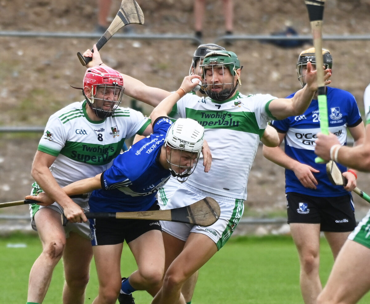 Sarsfield's Colm McCarthy is tackled by Kanturk's Lorcan McLoughlin and Paul Walsh. Picture: Eddie O'Hare
