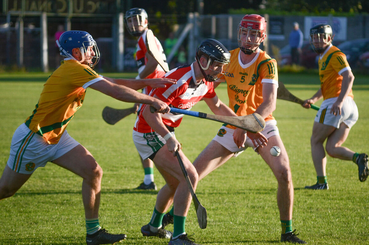 Ballincollig's Cian Dorgan reaches out for the sliotar despite the attention from Dungourney's James McCarthy and Mike Leahy. Picture: Howard Crowdy