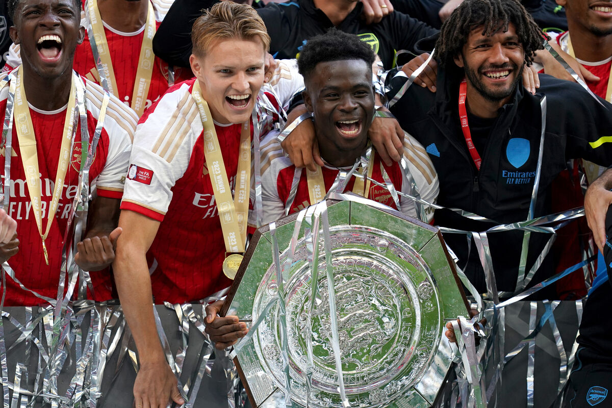 Arsenal's Martin Odegaard (left) and Bukayo Saka celebrates with the FA Community Shield after beating Man City in Wembley last weekend. 