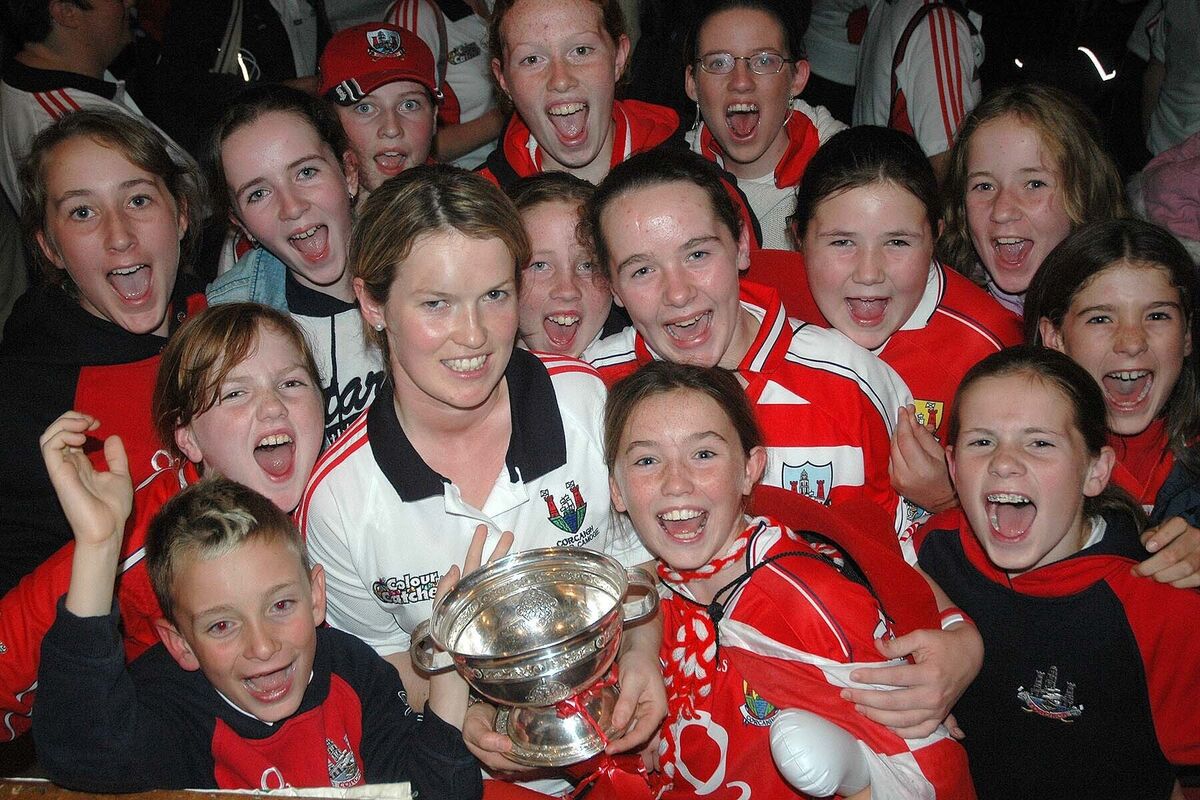 Elaine Burke, Cork senior camogie captain pictured amongst some of her young fans at the homecoming of the All Ireland O’Duffy Cup to Innishannon in 2005. Picture: Howard Crowdy Elaine Burke, Cork senior camogie captain pictured amongst some of her young fans at the homecoming of the All Ireland O’Duffy Cup to Innishannon in 2005. Picture: Howard Crowdy