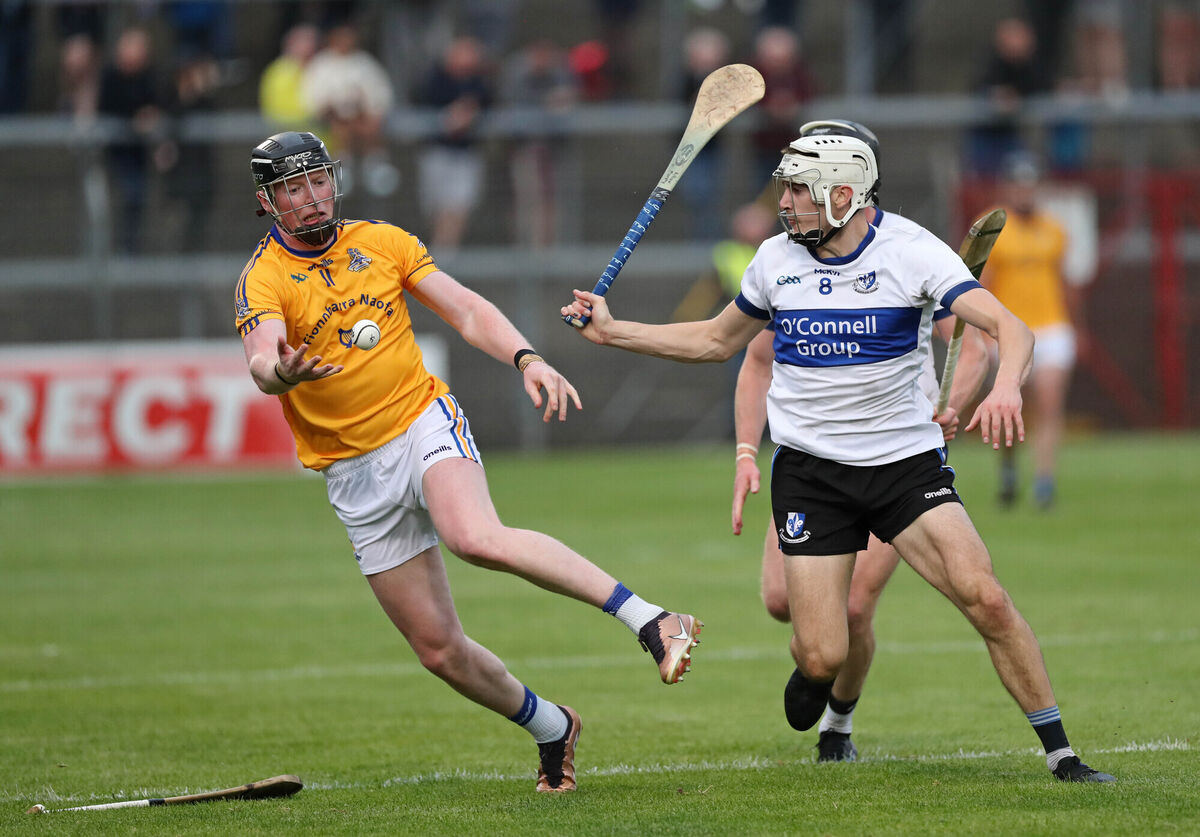  Conor Cahalane of St Finbarr's gets a pass away as Sarsfields' Killian Murphy closes in.  Picture: Jim Coughlan