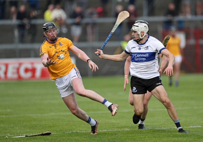  Conor Cahalane of St Finbarr's gets a pass away as Sarsfields' Killian Murphy closes in.  Picture: Jim Coughlan