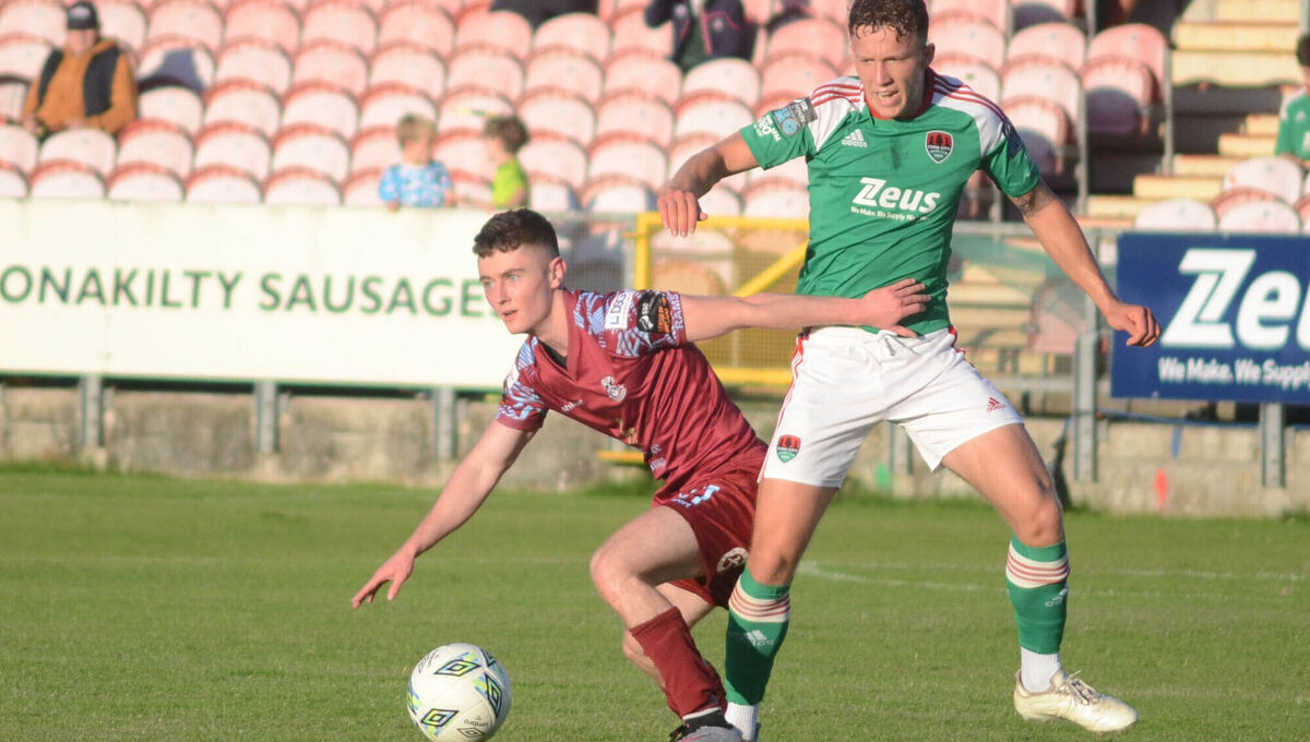 Cobh Ramblers Liam Kervick manages to keep the ball away from Cork City's Colin Henderson during the Munster Senior Cup Final in Turner's Cross. Picture: Howard Crowdy Cobh Ramblers Liam Kervick manages to keep the ball away from Cork City's Colin Henderson during the Munster Senior Cup Final in Turner's Cross. Picture: Howard Crowdy