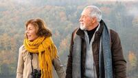 Senior couple on a walk in an autumn nature.