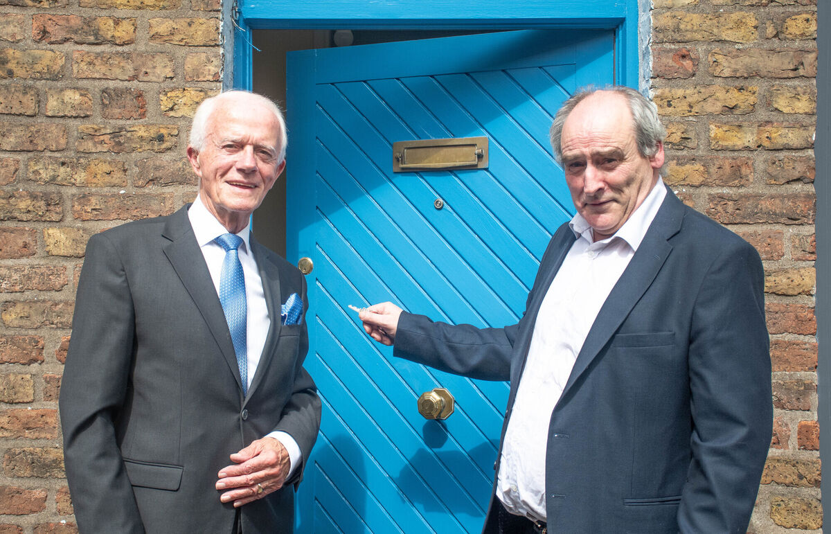 John O'Donnell opens the front door to his new home watched by Paddy O'Brien, Advocate to the Elderly at Maddens Buildings in Blackpool. Picture: Howard Crowdy