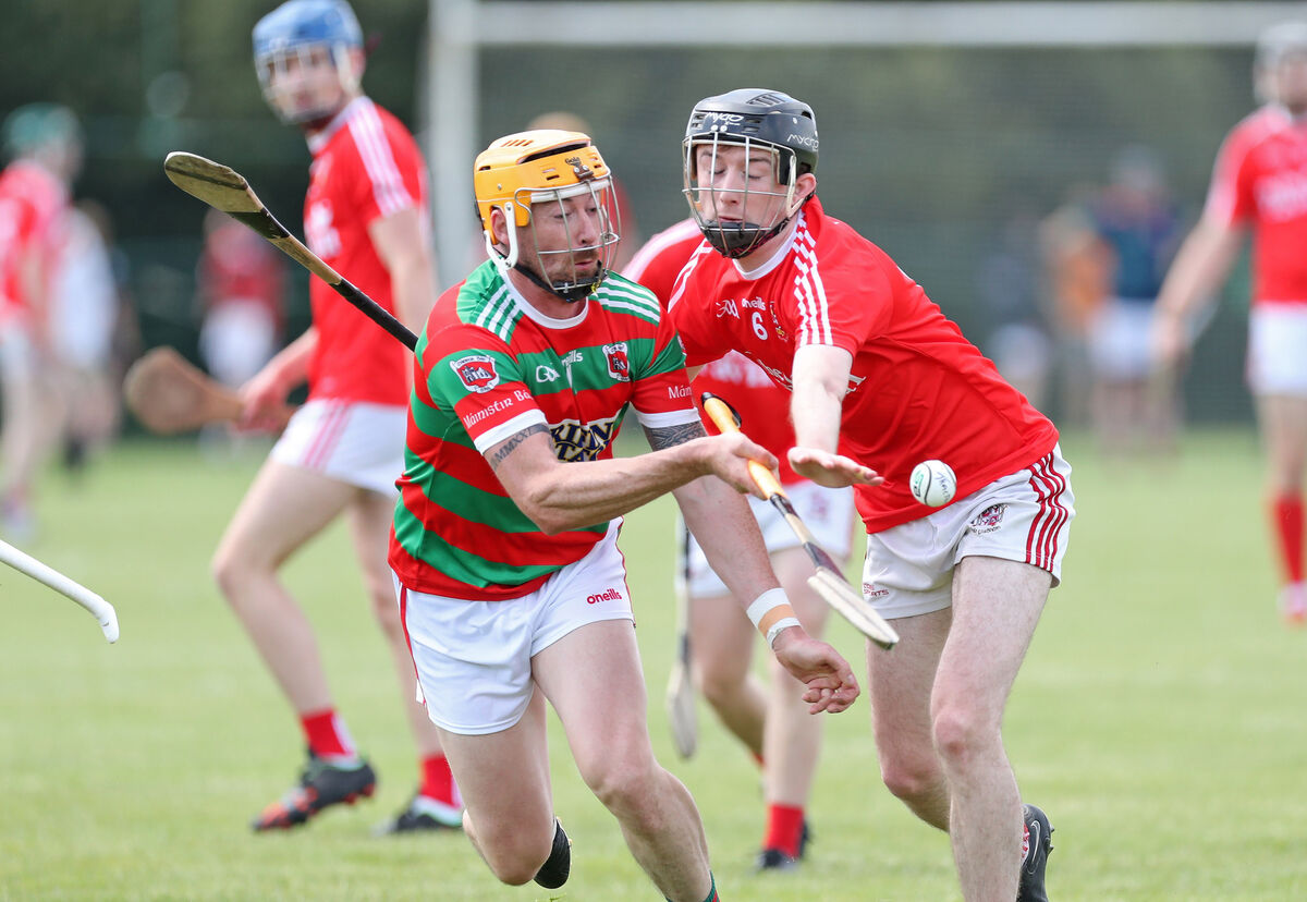 Graham Webb, Tracton, Paul Sexton, Ballygarvan, battling for the ball during the Division 6 league final last month. Picture: Jim Coughlan