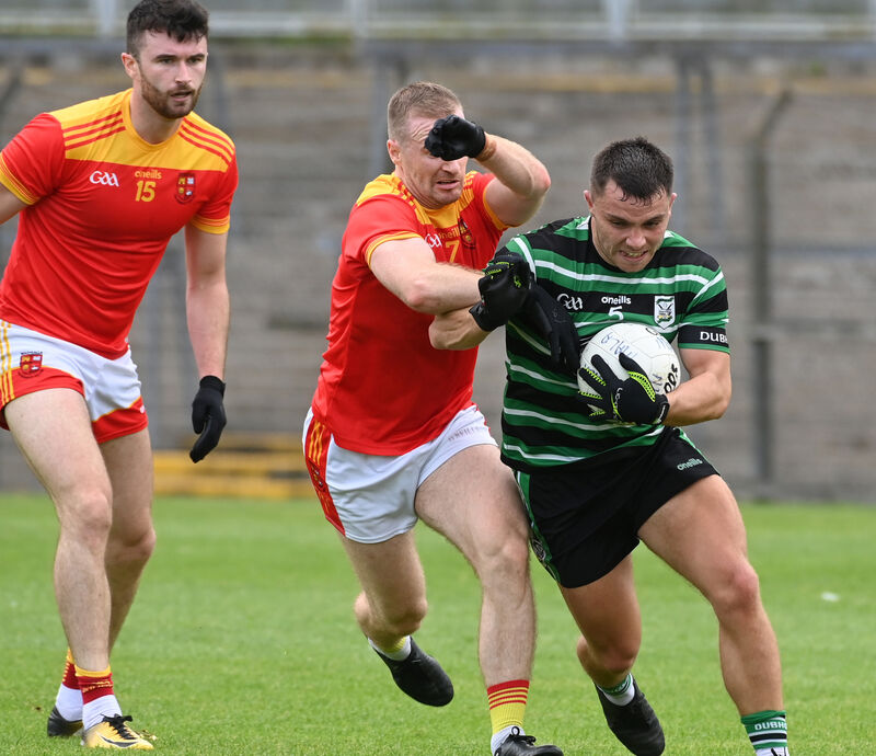 Douglas' Sean Powter is tackled by Mallow's Matty Taylor. Picture: Eddie O'Hare