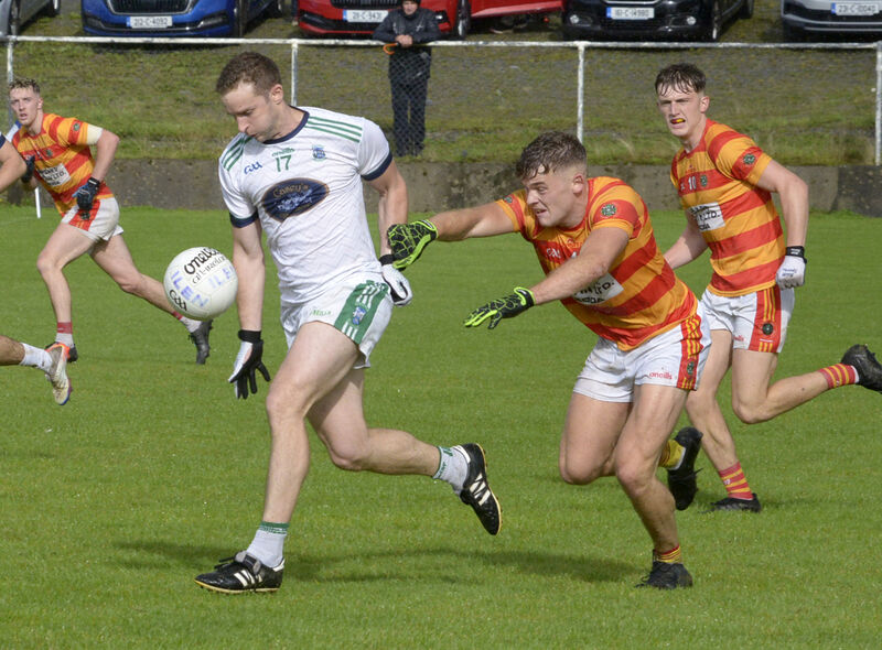 Newcestown's Gearoid O'Donovan tackling Ilen Rovers' Alan Holland. Picture: Denis Boyle