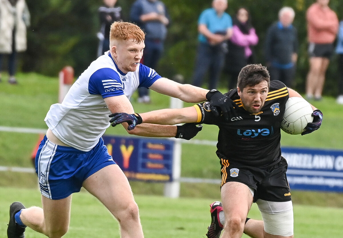  Fermoy's Tomas Clancy is tackled by Knocknagree's Michael McSweeney. Picture: David Keane.