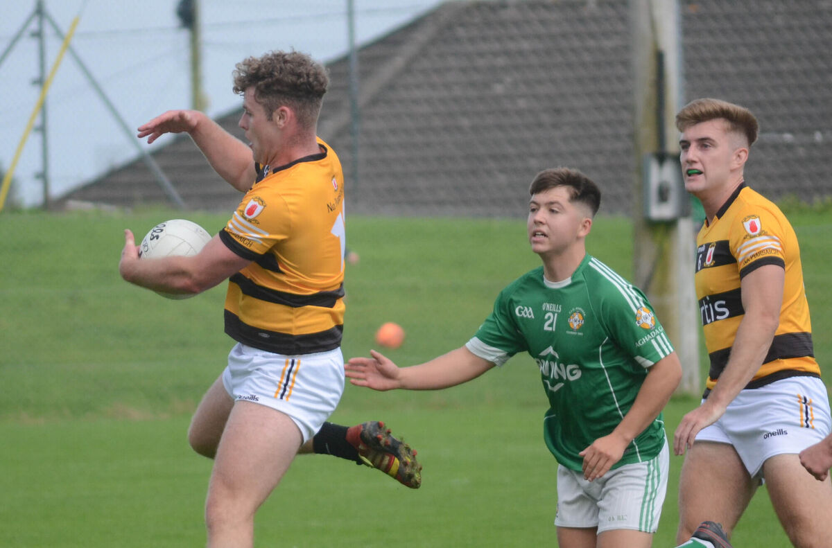Na Piarsaigh's Ryan Lynch gathers the ball ahead of Aghada's Max Aherne. Picture: Howard Crowdy Na Piarsaigh's Ryan Lynch gathers the ball ahead of Aghada's Max Aherne. Picture: Howard Crowdy