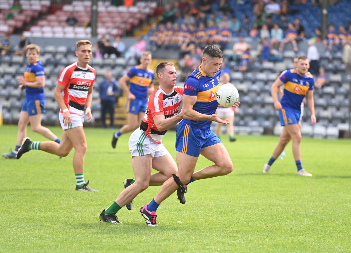  Niall Quirke, Carrigaline tries to shake off a challenge from Cian Kiely, Ballincolling. Picture: Larry Cummins
