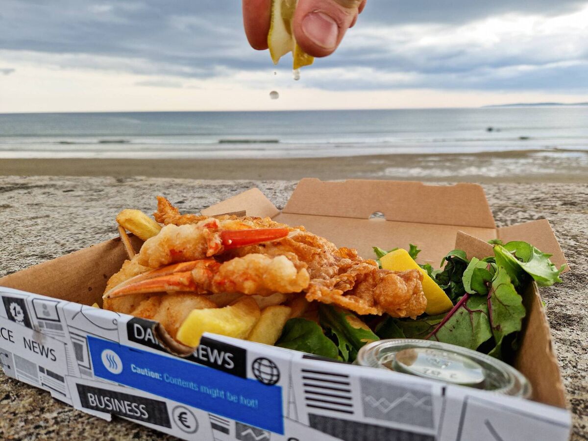 Squeezing lemon drops over lobster claws, at The Wild Fish, food truck. Picture: Richard Gordon. Squeezing lemon drops over lobster claws, at The Wild Fish, food truck. Picture: Richard Gordon.