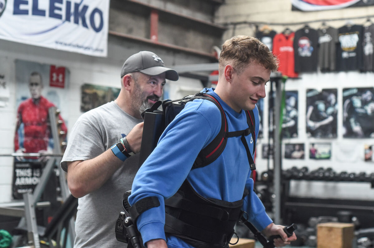 Mark Dalton uses a robotic exoskeleton for walking exercises at Elite Fitness Cork - assisted by Colin O'Shaughnessy, Owner/Manager of Elite Fitness Cork. Picture: Cian O'Regan. Mark Dalton uses a robotic exoskeleton for walking exercises at Elite Fitness Cork - assisted by Colin O'Shaughnessy, Owner/Manager of Elite Fitness Cork. Picture: Cian O'Regan.