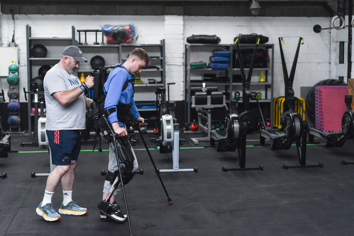 Mark Dalton uses a robotic exoskeleton for walking exercises at Elite Fitness Cork - assisted by Colin O'Shaughnessy, Owner/Manager of Elite Fitness Cork. Picture: Cian O'Regan. Mark Dalton uses a robotic exoskeleton for walking exercises at Elite Fitness Cork - assisted by Colin O'Shaughnessy, Owner/Manager of Elite Fitness Cork. Picture: Cian O'Regan.
