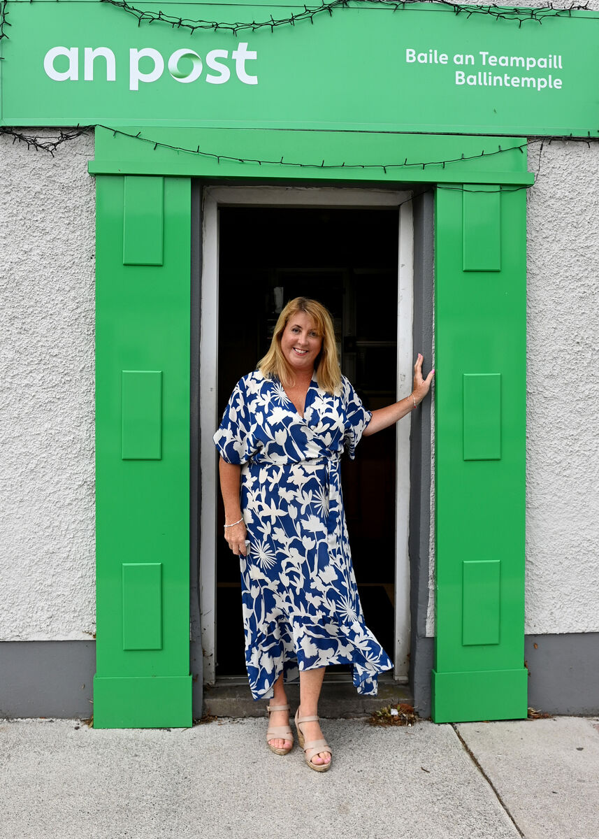 Colette Collins, outside Ballintemple Post Office, which has been in her family for 63 years. Pictures: Eddie O'Hare
