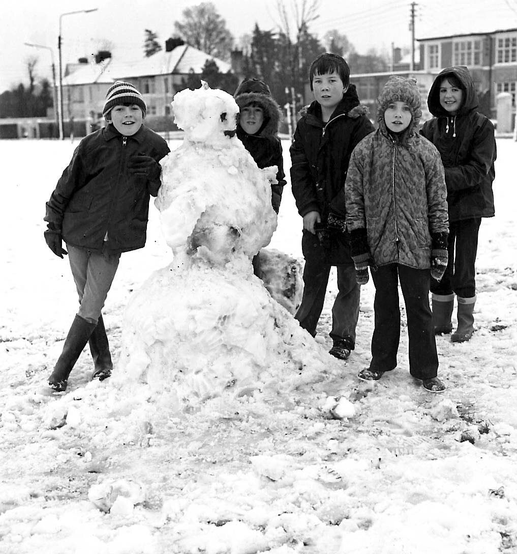 Children pose proudly with their snowman at The Lough, Cork, on January 21, 1979.