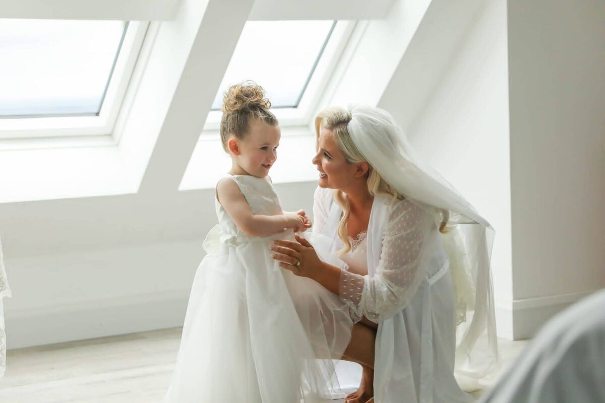 Bride Karen Mohally with her daughter Ava, aged two and a half, who was flower girl on the day. Bride Karen Mohally with her daughter Ava, aged two and a half, who was flower girl on the day.