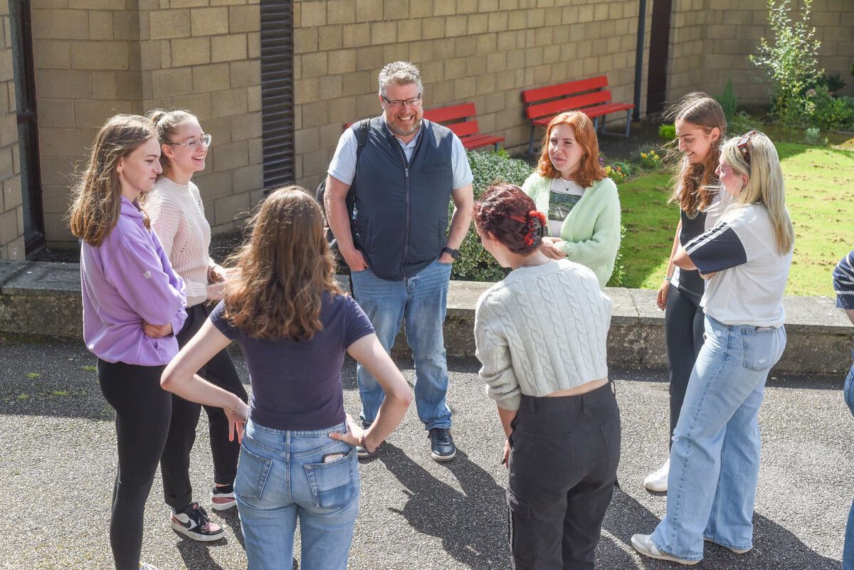 St. Aloysius' Girls Secondary School, Carrigtohill, chat with Mr Sweetnam after receiving their Leaving Cert results on Friday. Picture: Cian O'Regan.