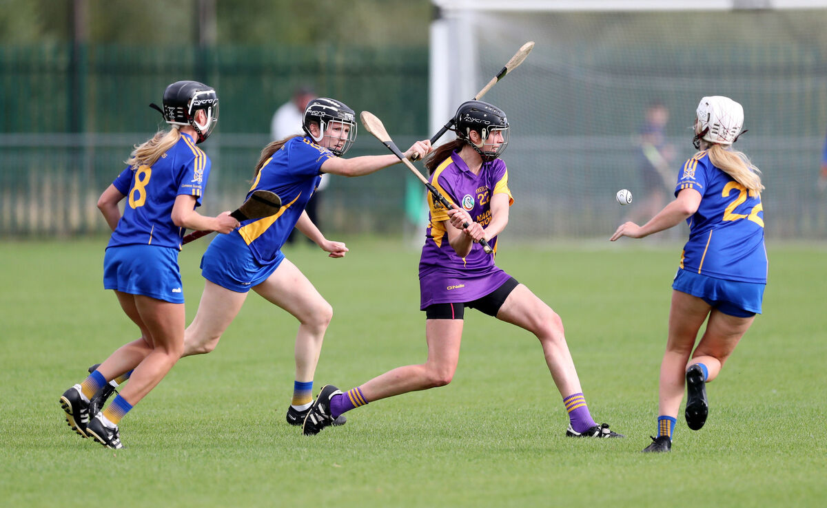 Orla Cotter, St. Catherine's, clears from Ciara Golden, Aisling Egan and Kate Wall, St Finbarr's. Picture: Jim Coughlan. Orla Cotter, St. Catherine's, clears from Ciara Golden, Aisling Egan and Kate Wall, St Finbarr's. Picture: Jim Coughlan.