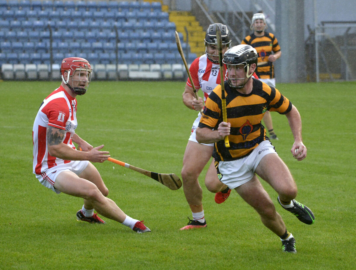  Brian Buckley of Avondhu looks to evade Imokilly pair John Cronin and Joe Stack. Picture: Denis Boyle