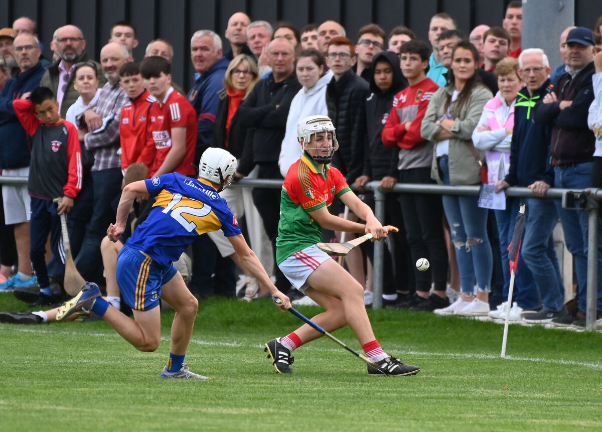 Kiltha Óg's Ben Cooney shoots past Carrigaline's Fionn Walsh during the Rebel Óg. Picture: Eddie O'Hare