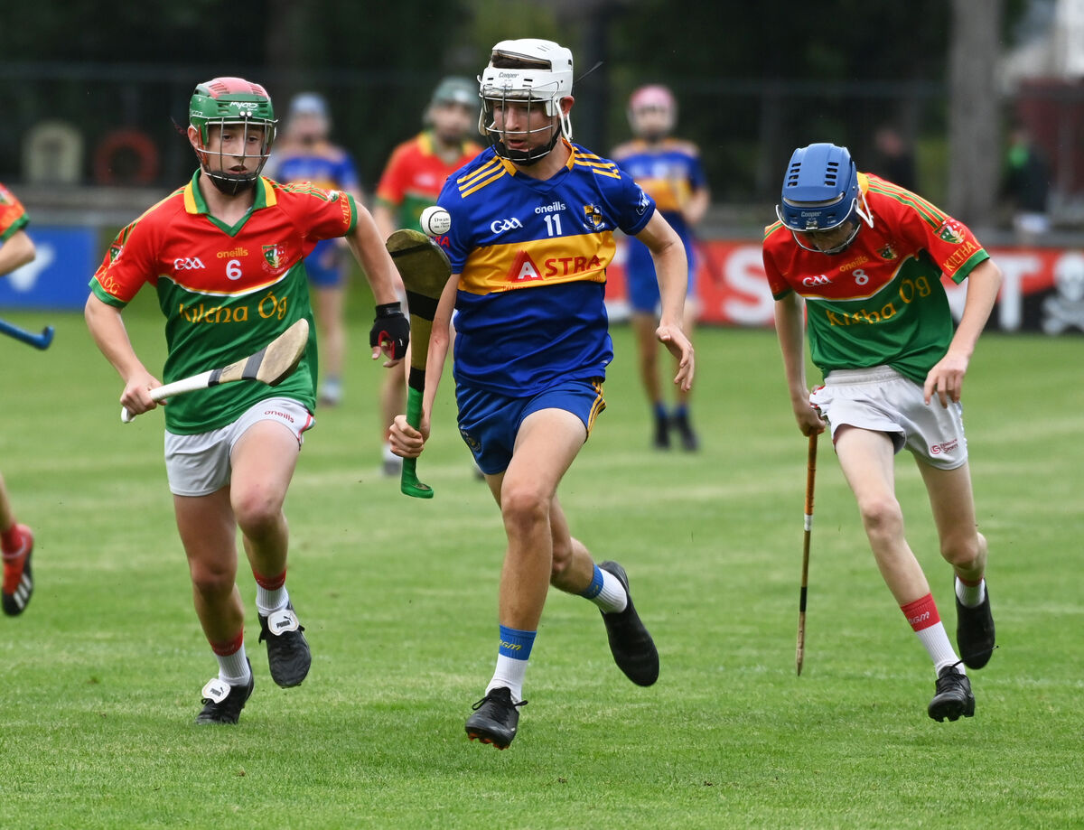Carrigaline's Charlie Hanratty breaks from Kiltha Óg's Finn Conaughton and Mark O'Mahony. Picture: Eddie O'Hare