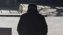 Lonely man on a sunny bench