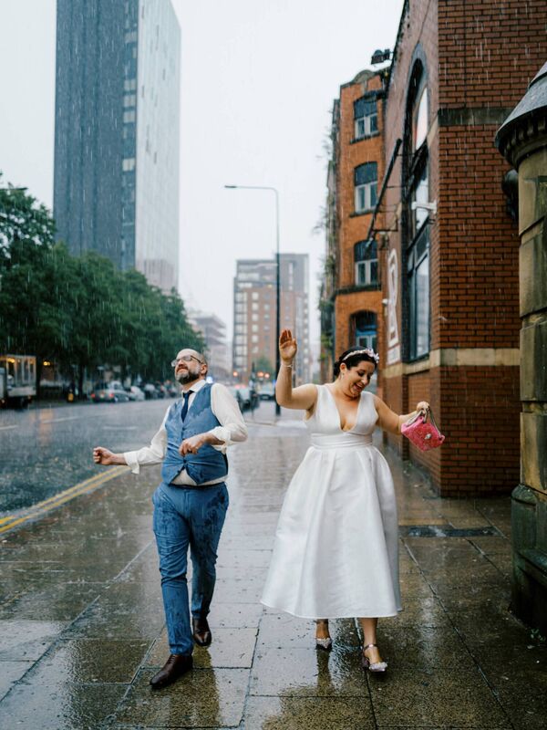 The sky opened during their walkabout, so they just went with it, and danced in the rain!