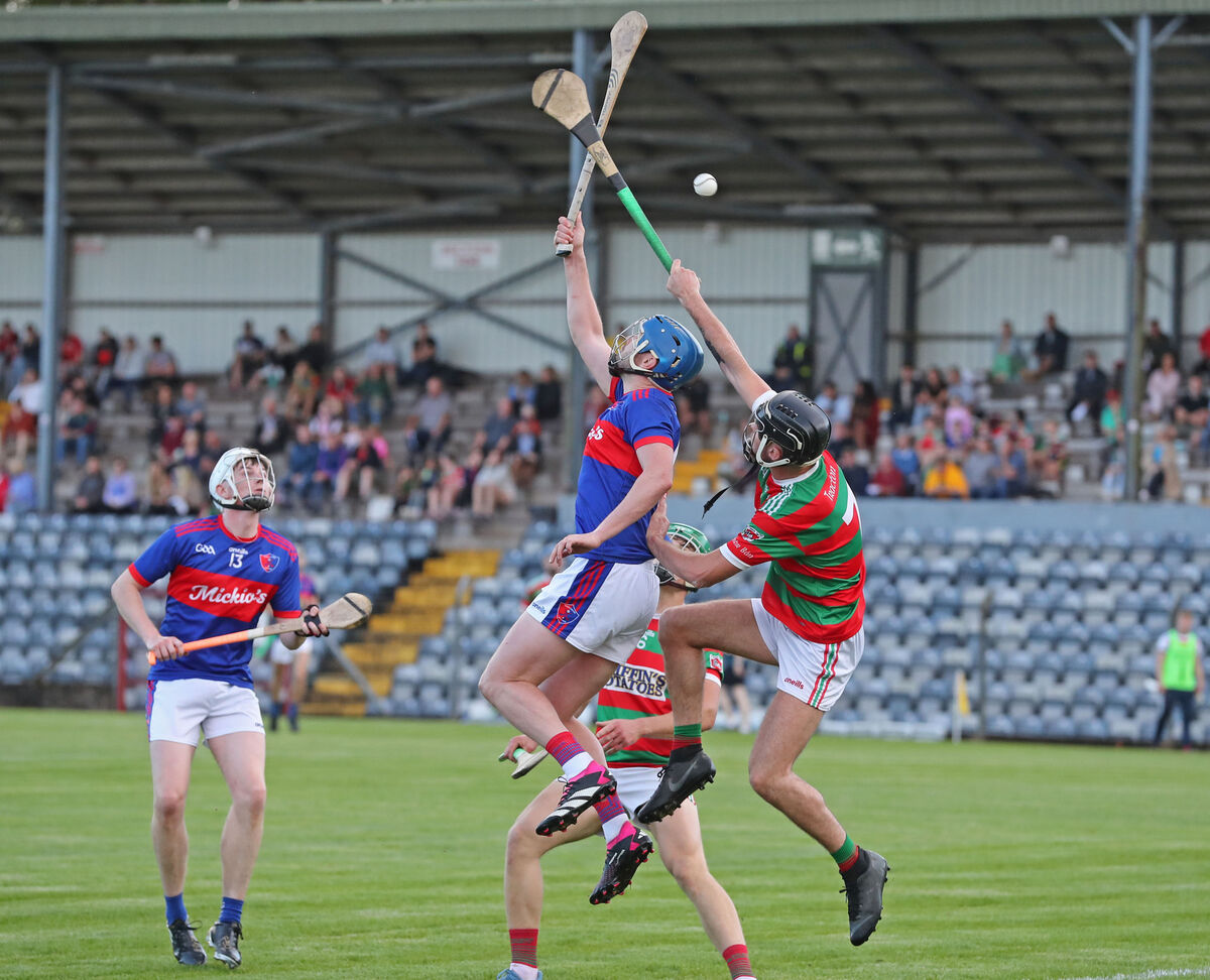 Darragh Kidney, Tracton, and James McMahon, Erin's Own, battle for the high ball. Picture: Jim Coughlan.