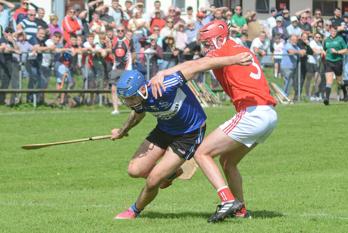 Sarsfields' Ben Graham manages to get past the challenge from Mayfield's Brian Punch. Picture: Howard Crowdy