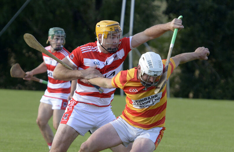 Newcestown's James Kelleher being tackled by Courcey Rovers Seán Twomey. Picture: Denis Boyle