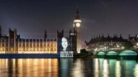 Victims’ images projected on British parliament as UK government urged to scrap legacy Bill