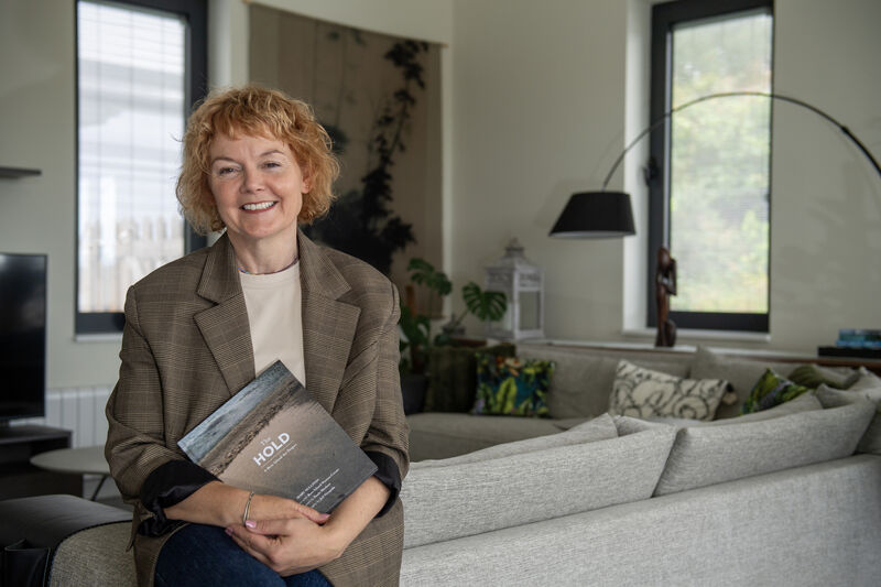Mary K Sullivan with the book, The Hold, which is a Bere Island Art Project in collaboration wit Bere Island Women Create. Picture Dan Linehan