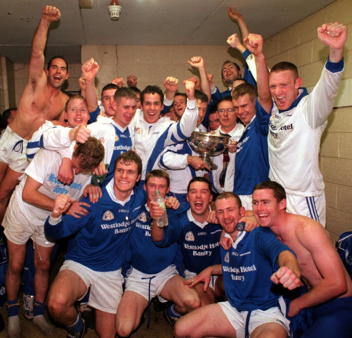 BANTRY BLUES v DUHALLOW. TSB CORK COUNTY SENIOR FOOTBALL CHAMPIONSHIP FINAL. The Bantry blues team in their dressing room after winning the T.S.B. Cork County S.F.C. at Pairc Ui Chaoimh. PIcture Dan LInehan