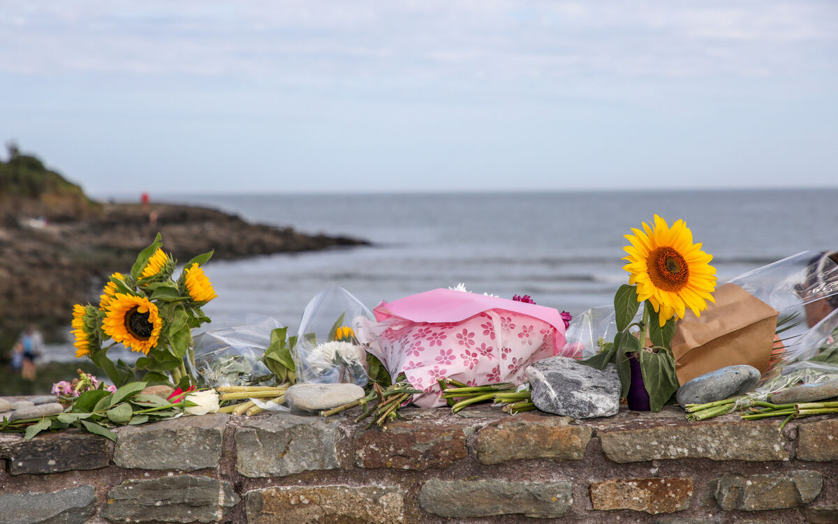 Flowers left on the wall of as a tribute to Emili Roman who lost her life in a tragic incident at Fountainstown Beach, Co. Cork. - Picture: David Creedon